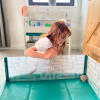 Playing in a hamster playpen